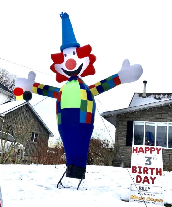 clown on snowy lawn